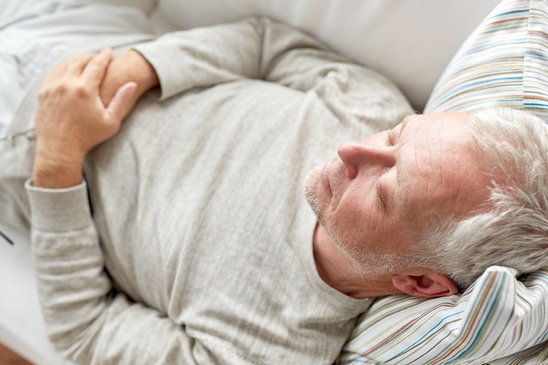 Older man resting comfortably